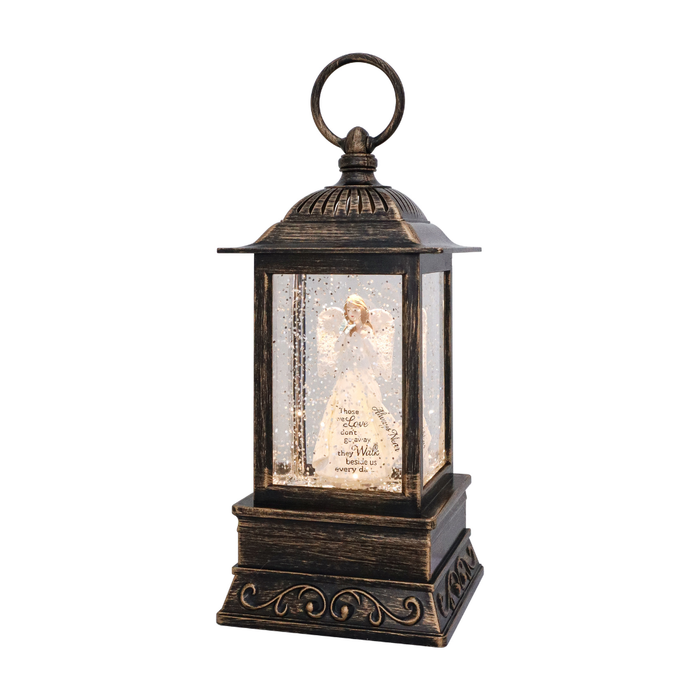 Decorative lantern with a figurine and text inside on a white background
