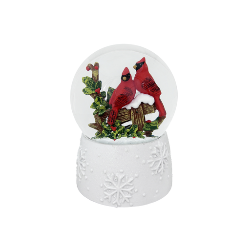 Snow globe with red cardinals on a white background