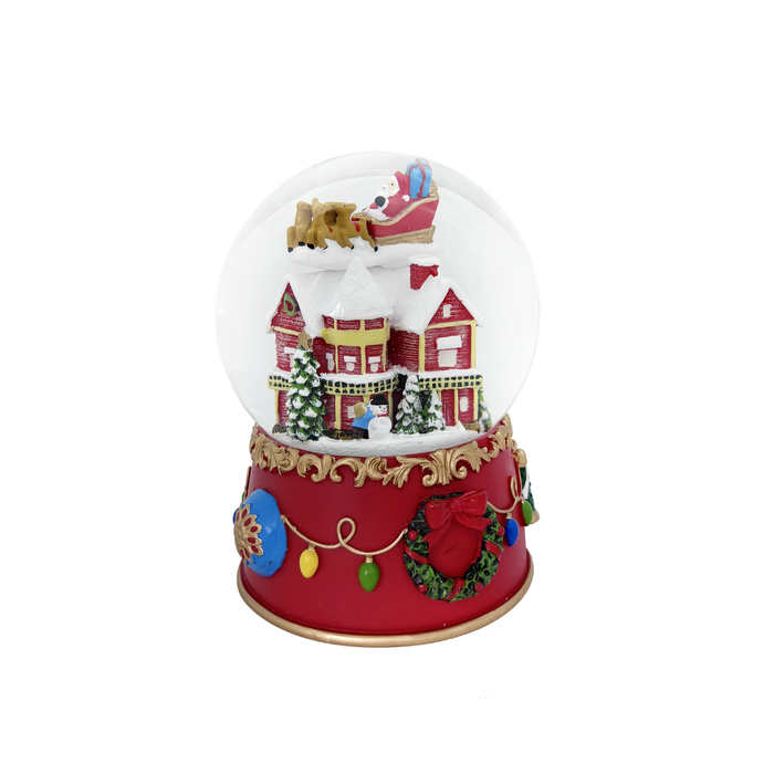 Christmas-themed snow globe with a red base and festive decorations on a white background