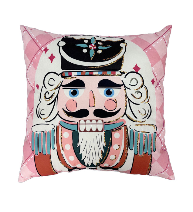 Decorative pillow with a nutcracker design on a pink checkered background