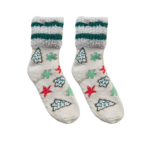 Pair of socks with Christmas tree and snowflake patterns on a white background