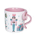 Mug with a nutcracker design and pink handle on a white background