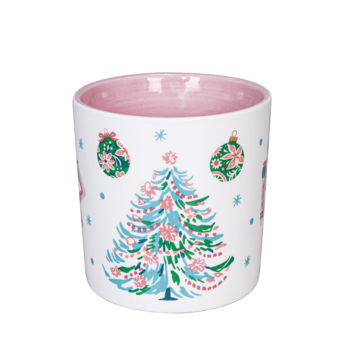 White mug with a colorful Christmas tree design on a white background