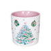 White mug with a colorful Christmas tree design on a white background