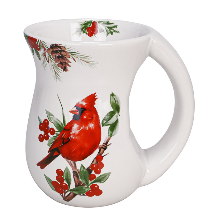 White mug with a red cardinal and winter elements on a white background