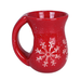 Red mug with white snowflake design on a white background