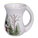 White mug with winter scene featuring trees and a snowman on a white background