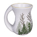 White mug with nature-themed design on a white background