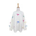 White sweater with colorful bow designs on a mannequin against a white background