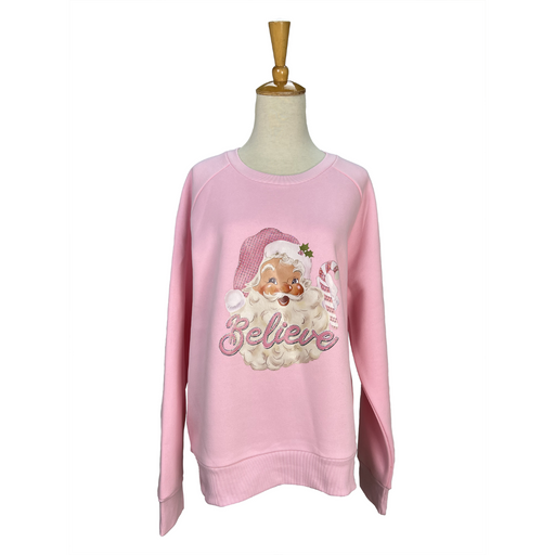 Pink sweater with Santa Claus graphic and 'Believe' text on a mannequin against a white background