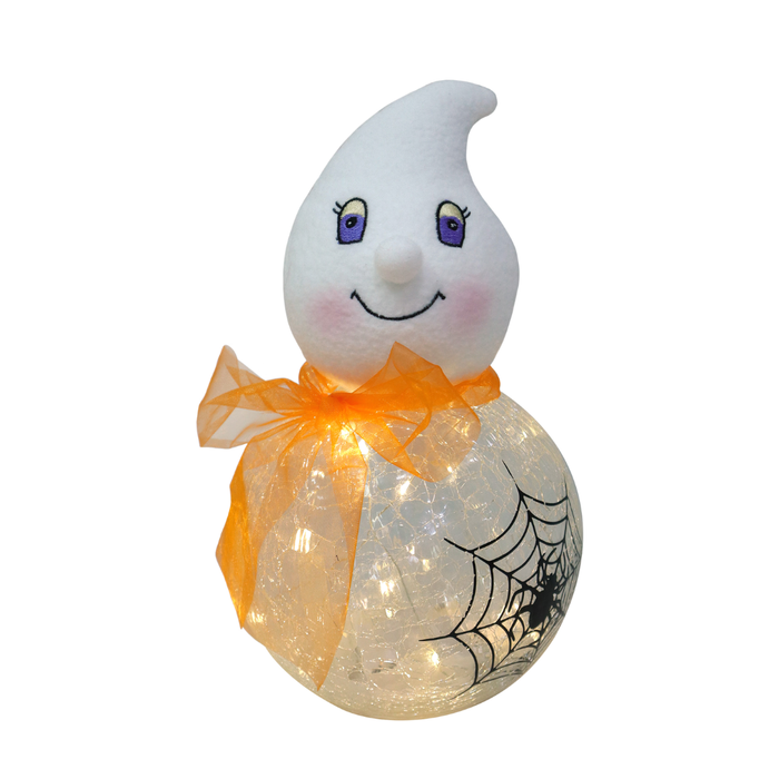 A cute ghost-shaped Halloween decoration with a white plush head, purple eyes, a smiling mouth, pink cheeks, an orange sheer bow, and a glowing clear sphere body with embedded fairy lights and a black spiderweb design.