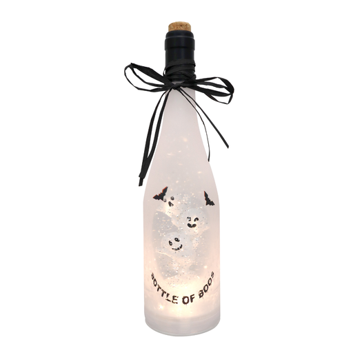 A frosted glass bottle with a cork stopper, decorated with a black ribbon bow and featuring printed ghost illustrations and the text 'BOTTLE OF BOO'. The bottle is illuminated from within with warm white fairy lights, set against a plain white background.
