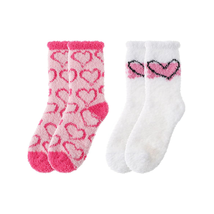 Two pairs of socks with heart patterns on a white background