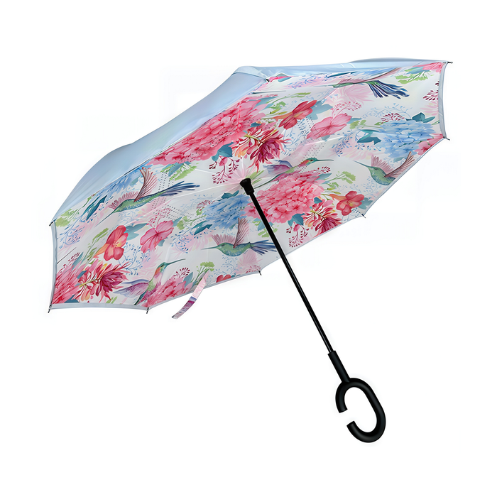 Floral patterned umbrella with a black C-shaped handle on a white background