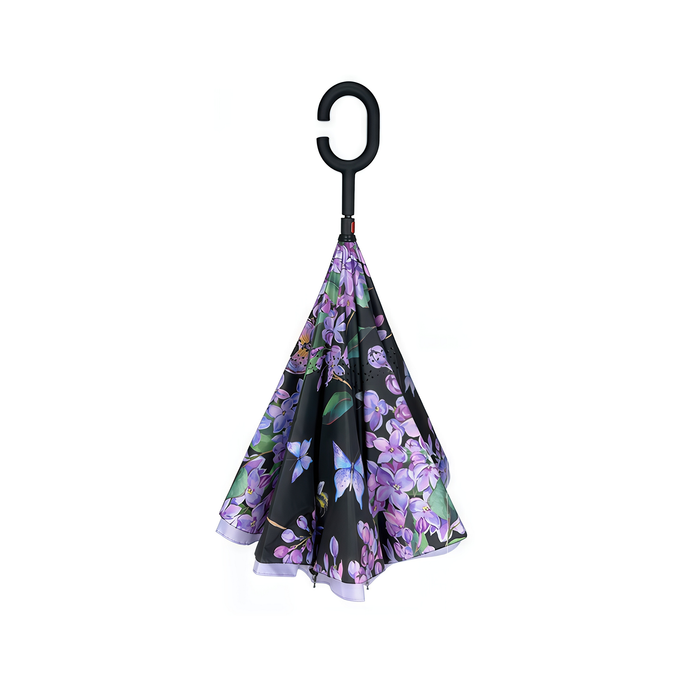 Floral-patterned umbrella with a black handle on a white background