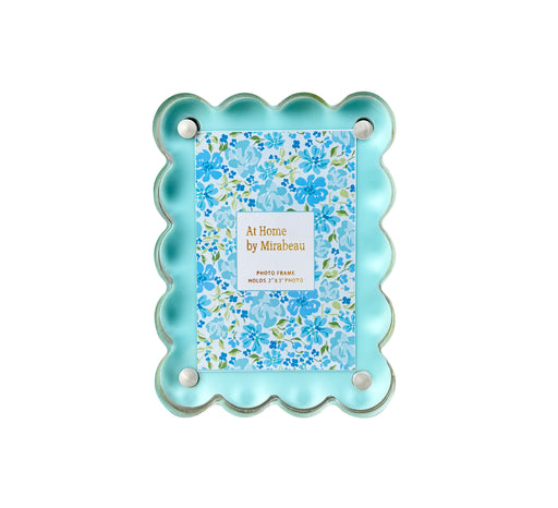 Decorative photo frame with scalloped edge and floral design on a white background