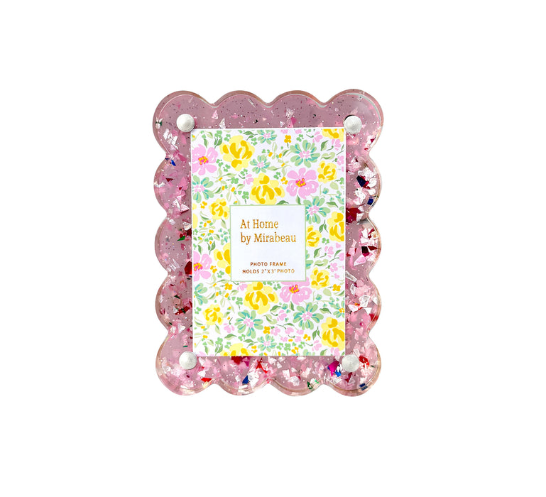 Decorative photo frame with floral design and 'At Home by Mirabeau' text on a white background