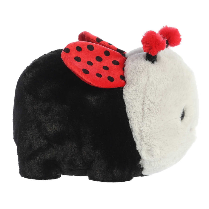 Plush toy resembling a ladybug with black and red body and white face on a white background