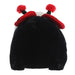 Black plush toy with red pom-pom ears on a white background