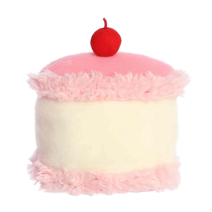 Plush toy shaped like a cupcake with pink and white frosting and a red cherry on top.