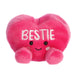 Pink plush heart with 'BESTIE' text on a white background