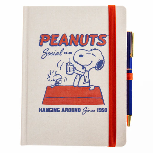 Notebook with Peanuts design featuring Snoopy and Woodstock, and a pen on a white background.