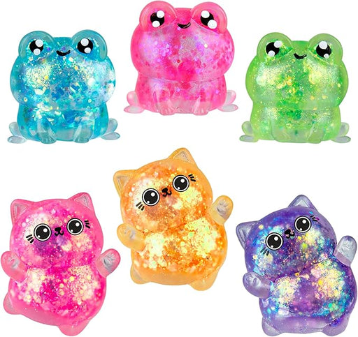 Set of colorful glowing cat and frog figurines on a white background