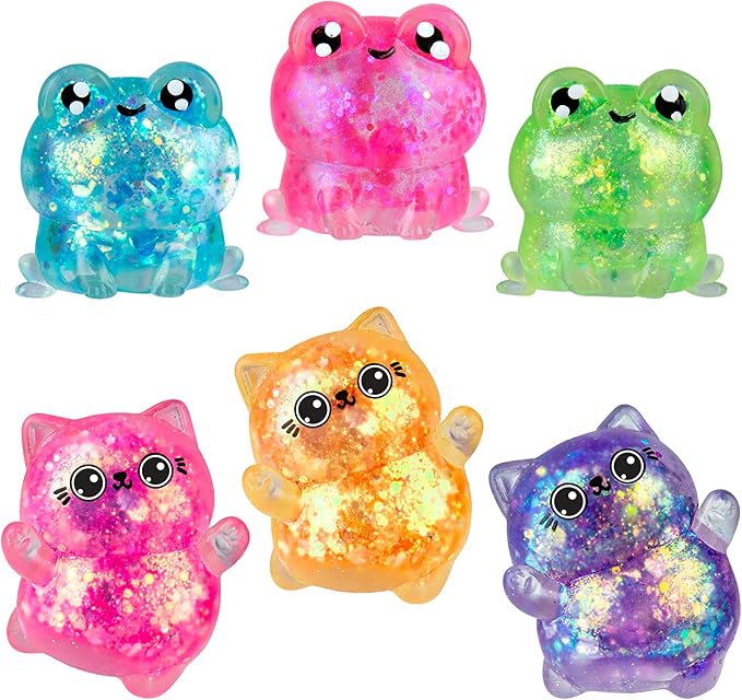 Set of colorful glowing cat and frog figurines on a white background