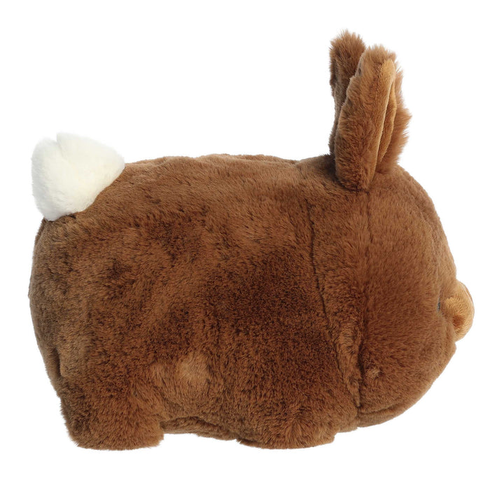 Plush toy resembling a brown animal with a white patch on a white background