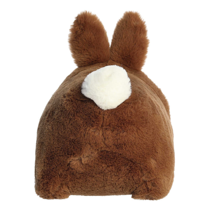 Plush toy resembling a brown animal with a white patch on a white background