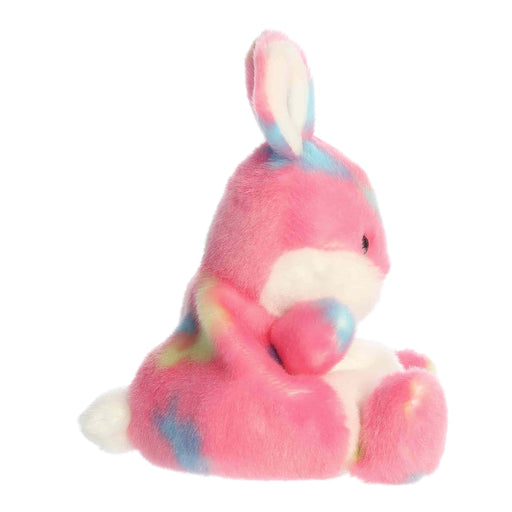 Plush toy rabbit with pink and blue pattern on a white background