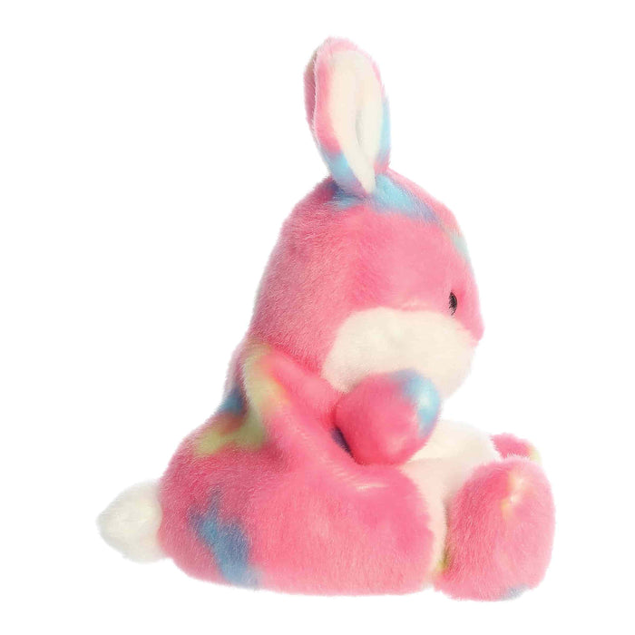 Plush toy rabbit with pink and blue pattern on a white background
