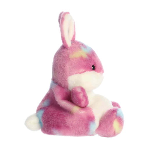 Plush toy rabbit with tie-dye pattern on a white background