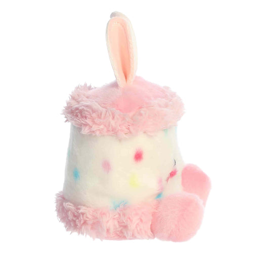 Plush toy with bunny ears and colorful polka dot pattern on a white background
