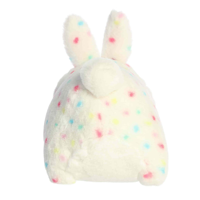 White plush toy with colorful polka dots on a white background