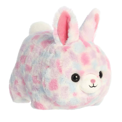 Plush toy rabbit with tie-dye pattern on a white background