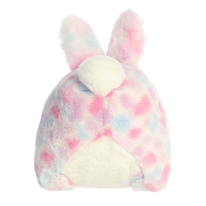 Plush toy with bunny ears in pastel tie-dye pattern on a white background