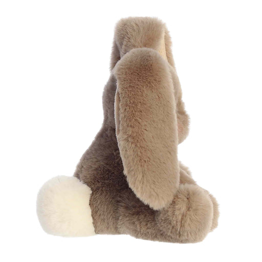 Plush toy resembling a rabbit with long ears on a white background
