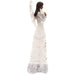 Statue of a woman in a long, elegant gown with intricate details on a white background