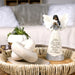 Decorative angel figurine on a table with a blurred indoor background