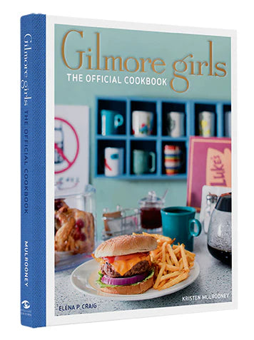 Book titled 'Gilmore Girls: The Official Cookbook' with a burger and fries on the cover.