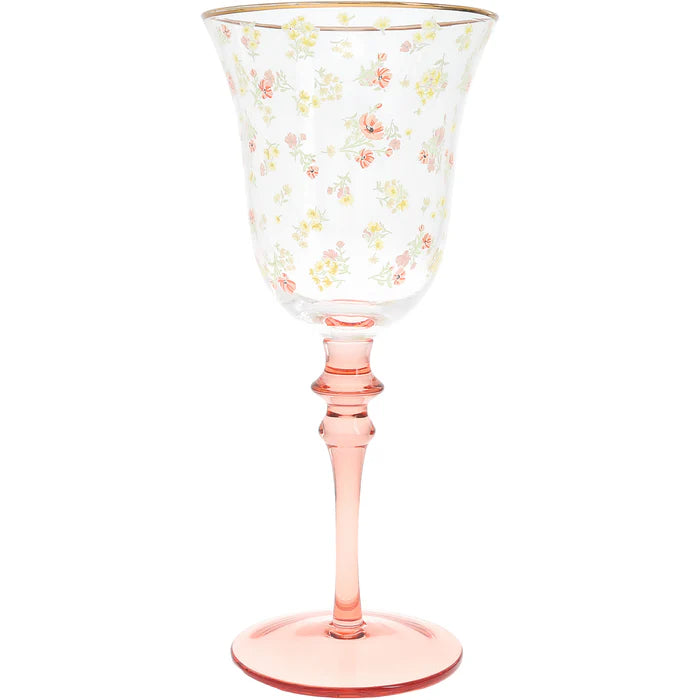 Goblet with floral pattern and pink stem on a white background