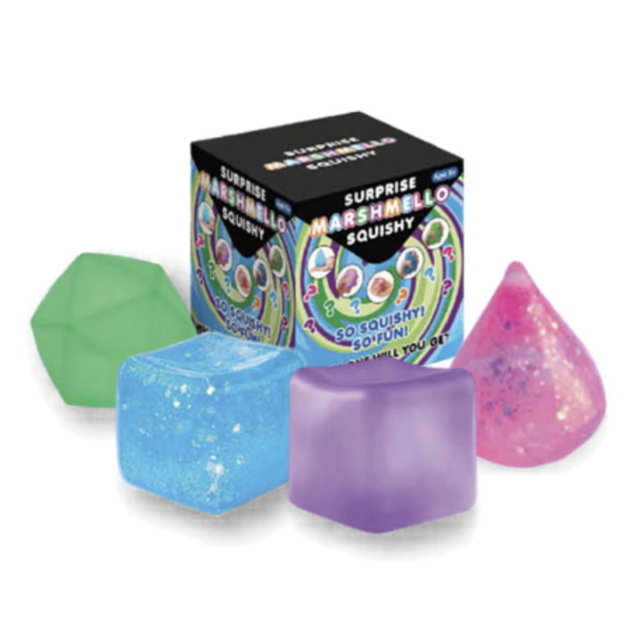 A box of Surprise Marshmallow Squishy toys with four colorful squishy shapes in front: a green faceted shape, a blue glittery cube, a purple glittery cube, and a pink glittery teardrop, on a white background.
