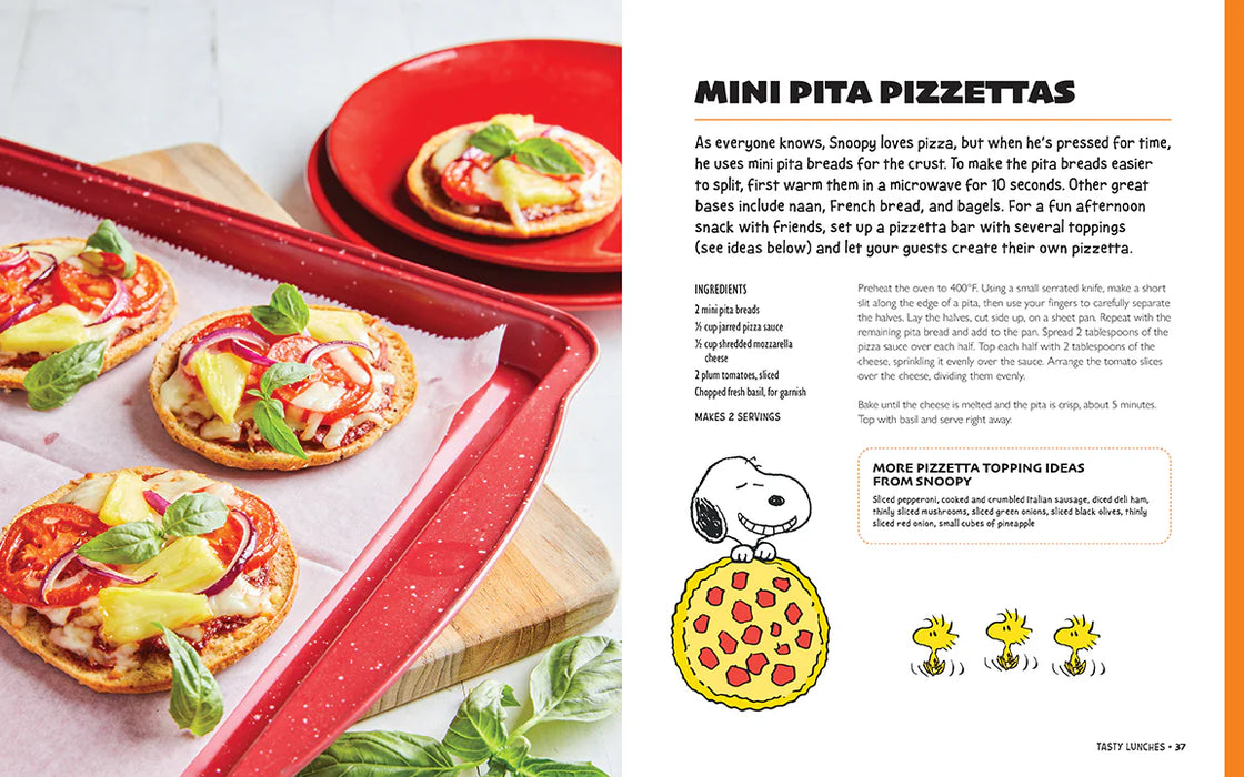 Mini pita pizzas on a baking tray with a recipe and Snoopy illustration.