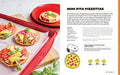Mini pita pizzas on a baking tray with a recipe and Snoopy illustration.