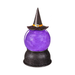 A Halloween-themed decorative crystal ball with a glowing purple interior, topped with a black witch hat featuring a gold band, set on a black glittery base against a white background.