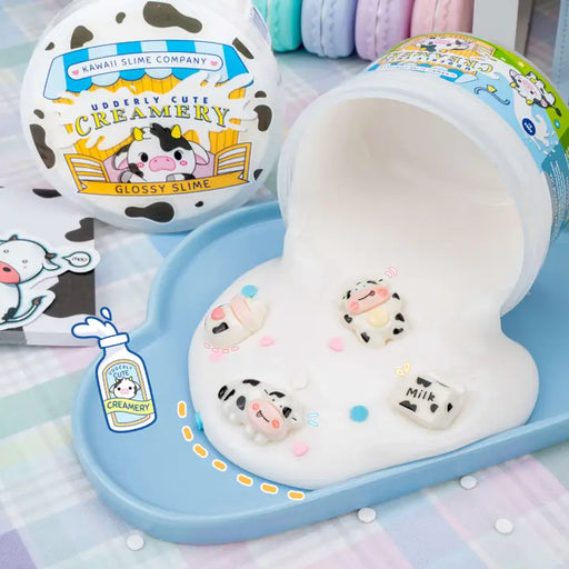 Kawaii slime product with cow-themed packaging and characters on a checkered background.