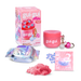 A pink beauty slime kit by gui-gui. Mihi Glow, shown with its retail box, a pink jar, a silver and blue iridescent foil packet labeled BASE, a pink packet labeled BOOST, a small pile of pink slime, and blue heart-shaped pieces on a white background.