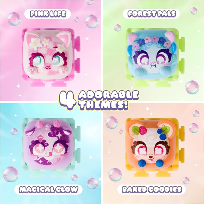Four colorful toy compact-style containers arranged in a 2x2 grid with text labels: Pink Life, Forest Pals, Magical Glow, and Baked Goodies. The products feature cute animal faces with large eyes and decorative themed details, surrounded by bubble graphics and a central '4 Adorable Themes!' message.