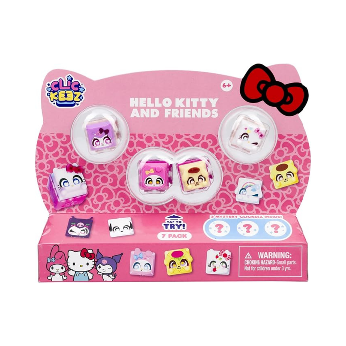 A pink retail display box for a 7-pack of Clik Krez Hello Kitty and Friends mystery clovers. The packaging features cartoon illustrations of Hello Kitty, Kuromi, and Pikachu, along with three clear plastic domes showing the colorful clover figures inside.